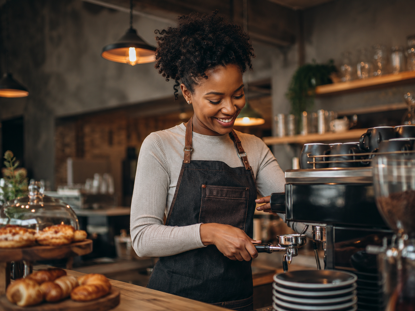 Barista crafting a latte at Paw & Pour Café